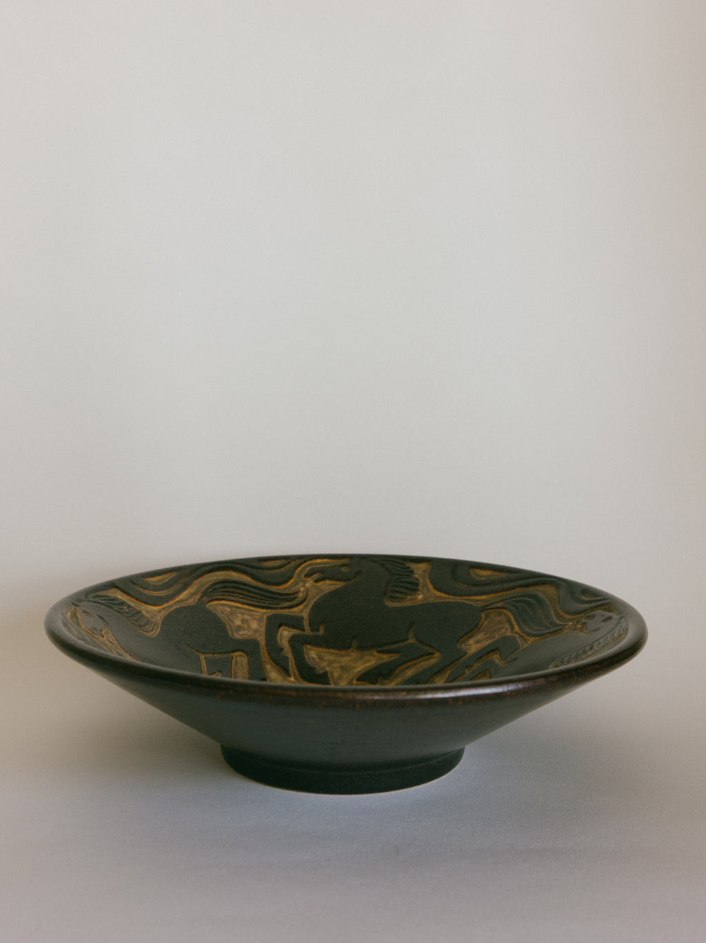 Stoneware Bowl with Galloping Horses in Relief